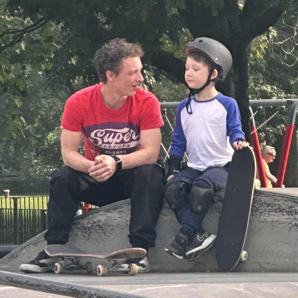 Thruday founder teaching his son to skateboard